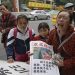 "Por favor, diga a todos que já não precisamos mais do dinheiro", pediu Zhou a cada jornalista que o entrevistava