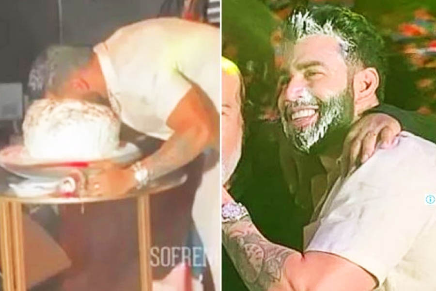 Gusttavo Lima enfia rosto no bolo | Foto: Reprodução